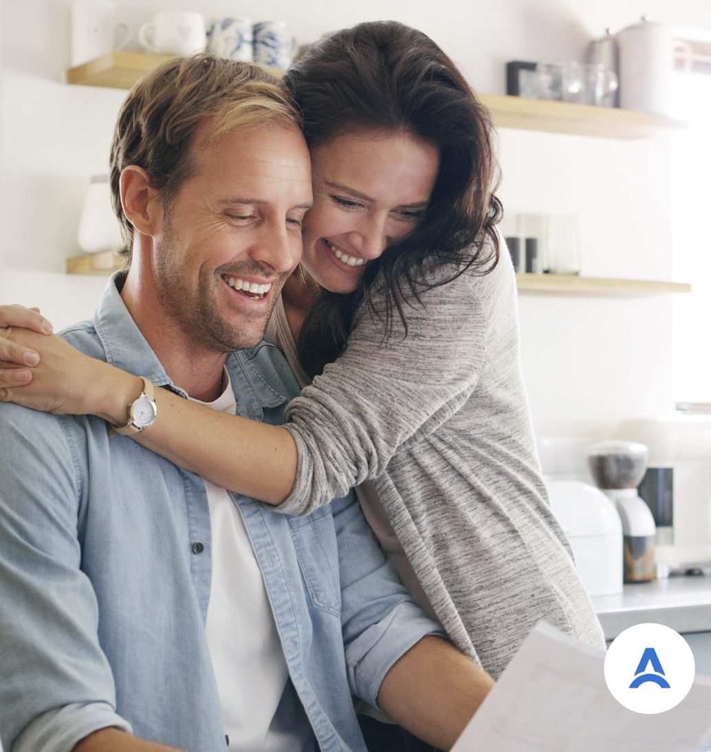 A couple smiling at home